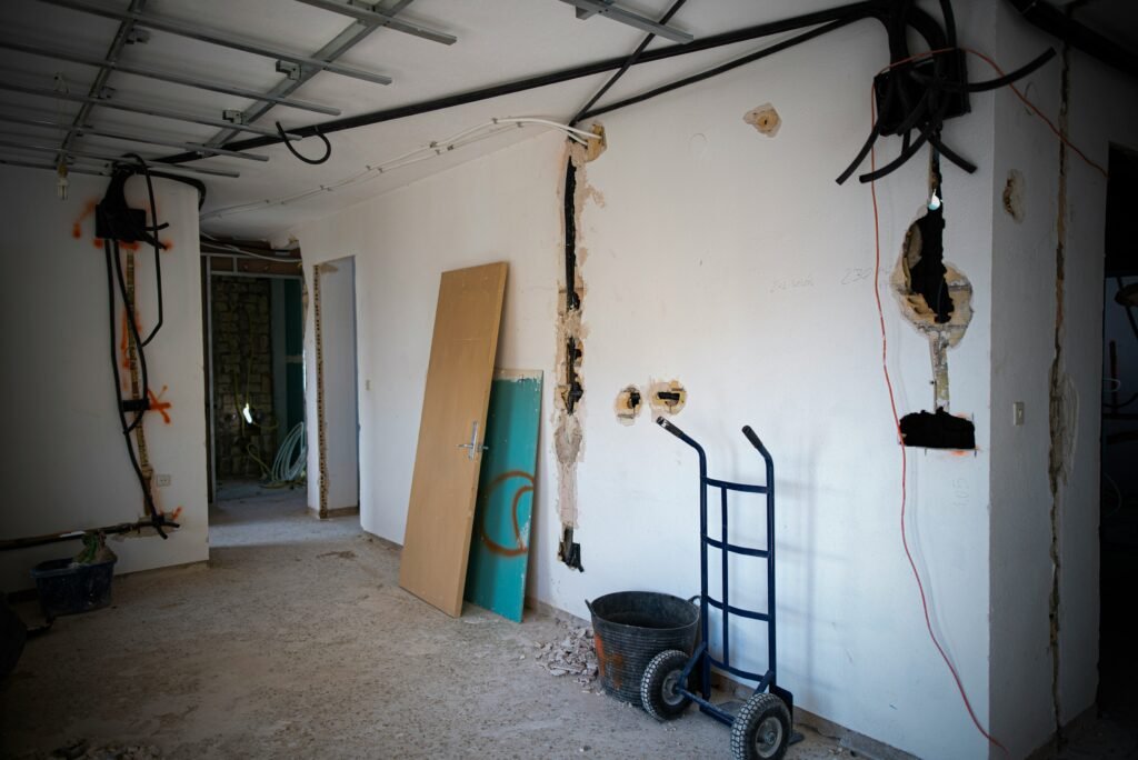 a room with a ladder and a door in it